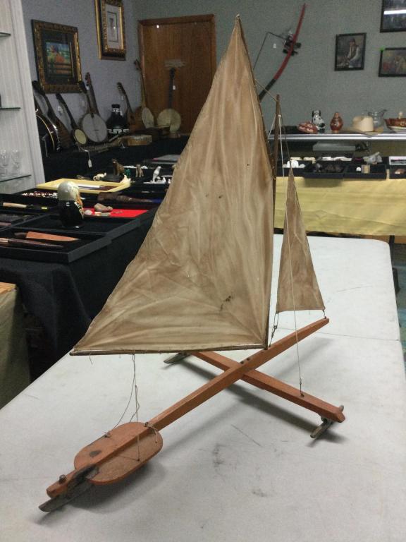 Vintage Wood Sail Boat: This was made for ice with metal runners. Neat older piece that measures 29 1/2"l x 26"h. Look at pictures this is a cool. Still has original label on it as well.