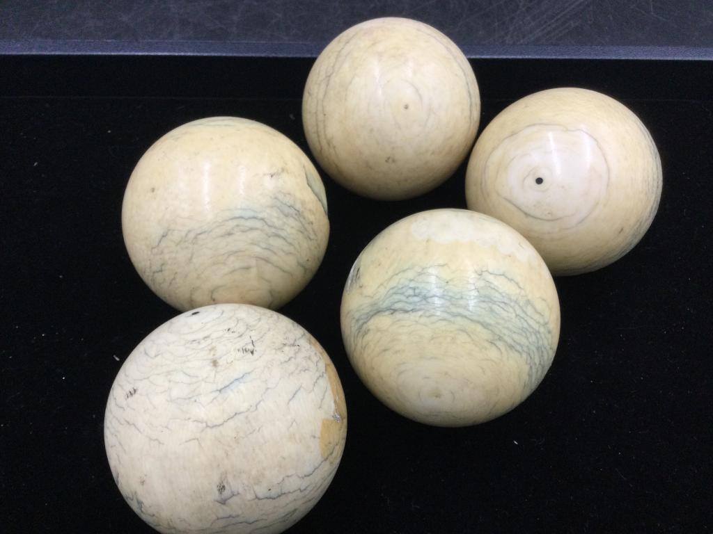 Vintage Cue Balls: Total of 5 in this lot. Two are almost perfect. 3-4 have a chip in them but nice and solid. The condition is consistent with age and use. See pictures. Please read our terms of sale, no refunds given.