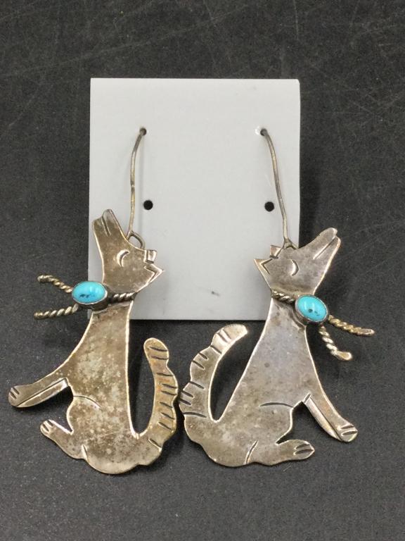Native American Sterling Earrings: Large earrings made to depict Wolfs and they have turquoise on collar. Measure 1 3/4"w x 1 1/4"w. They weigh a total of 9.4g. Condition is good. Please see our terms of sale, no refunds given.