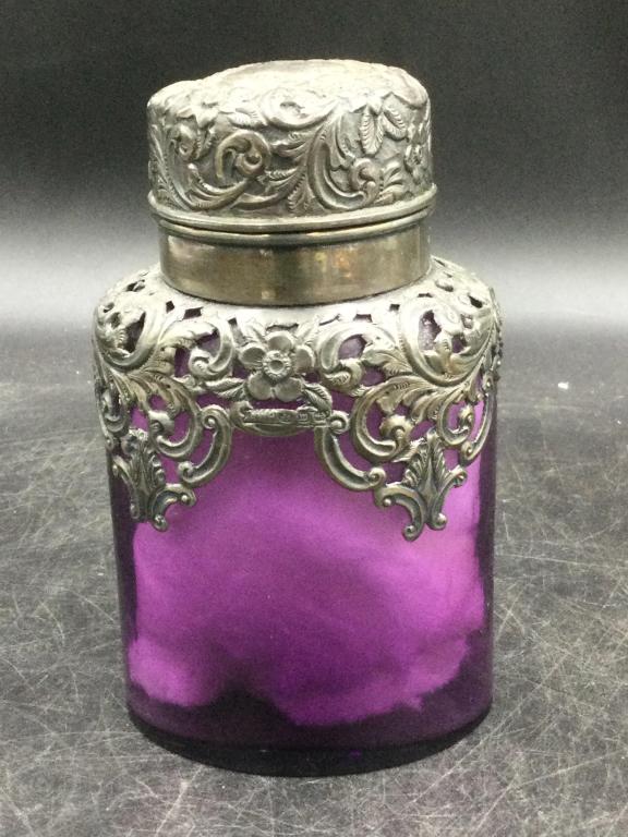 Vintage Dresser Sterling Bottle: Older piece circa 1800's of Amethyst glass with sterling on bottle and top. Measures 6"h x 3 1/4". No chips or cracks. Stunning piece. See pictures. Please read our terms of sale, no refunds given.