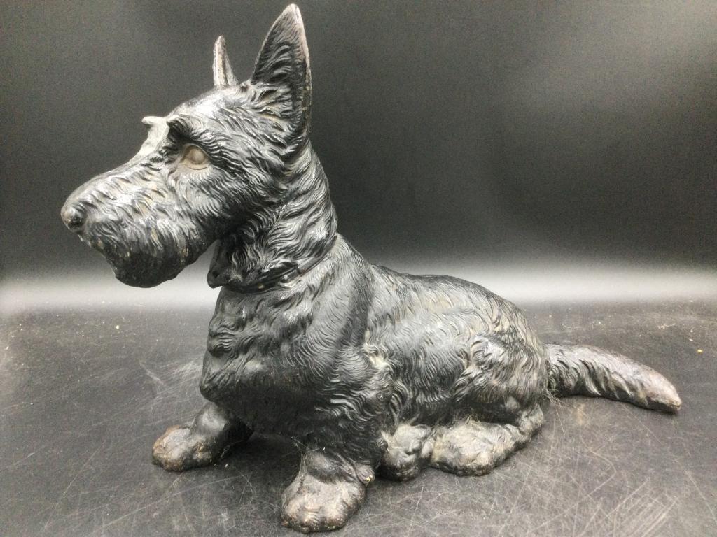 Vintage Cast Iron Scottish Terrier Dog: Larger cast iron door stop. piece that measures 11 1/2"h x 15"l x 5 1/2"w. Condition is good. Please read our terms of sale, no refunds given.