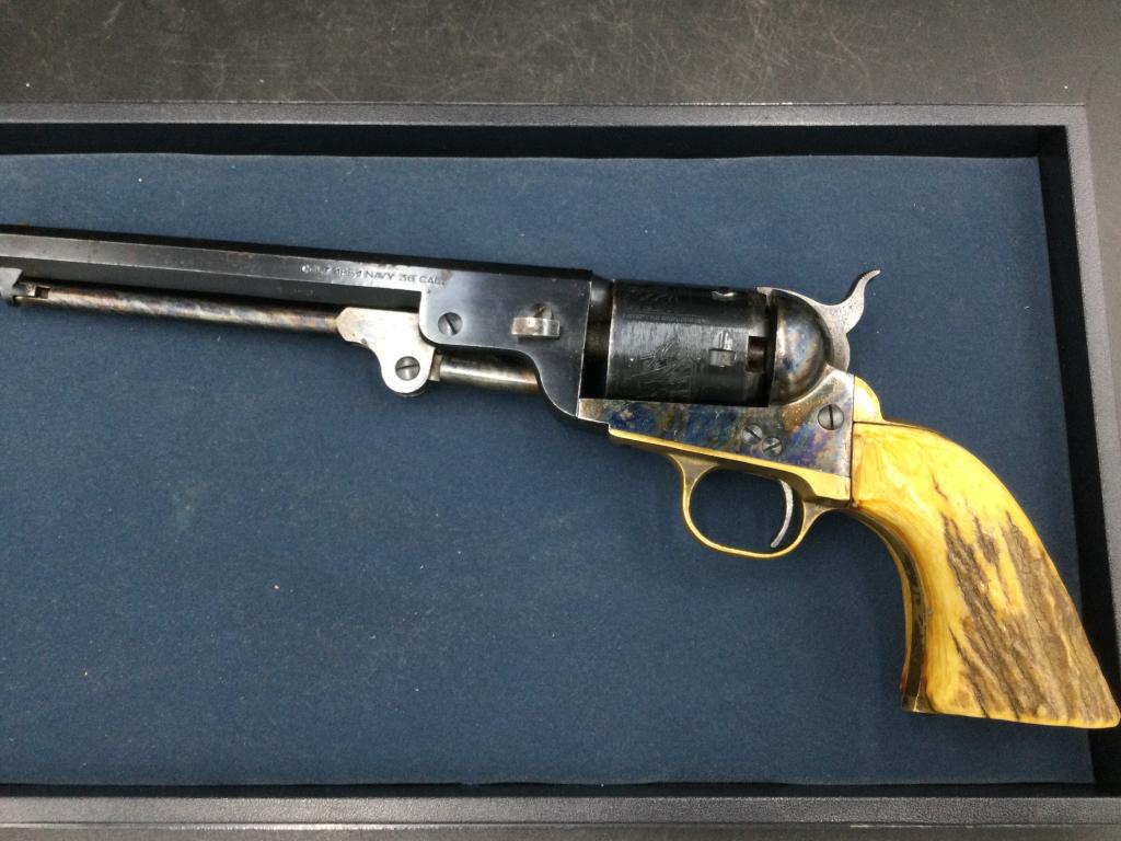 Black Powder Colt 1851 Navy: 36 cal. Stag handle Condition is consistent with age and use. See pictures. The bore appears dusty. The cylinder has some slight rust inside the holes. The cyylinder and action is tight and works fine