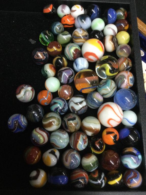 Marbles: Over 60 marbles in this lot. Vibrant colors with orange on some of the marbles, some Javas. See pictures this is a good one. Some marbles have imperfections. Please read our terms of sale, no refunds