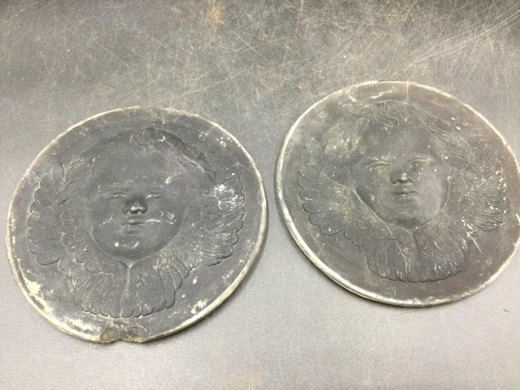 Tiffany Studio Cherubs Roundels: This a pair in this lot. Condition is consistent with age, see pictures. Measures 5 1/4". Please read our terms of sale, no refunds given.