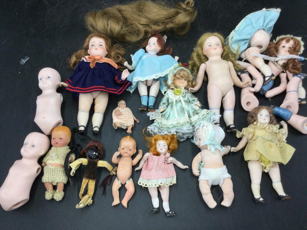 Vintage Porcelain Dolls: Box full of vintage porcelain dolls. See pictures for more info. Condition is consistent with age and use. No refunds given.