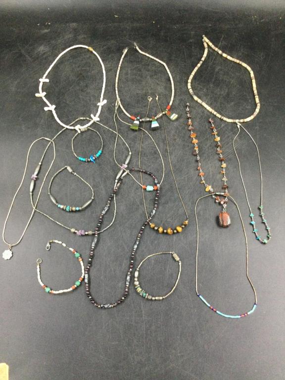 Native American Jewelry Lot: Total of 11 necklaces and 4 bracelets. Made with sterling and beads. Condition is good, see pictures. No refunds given.