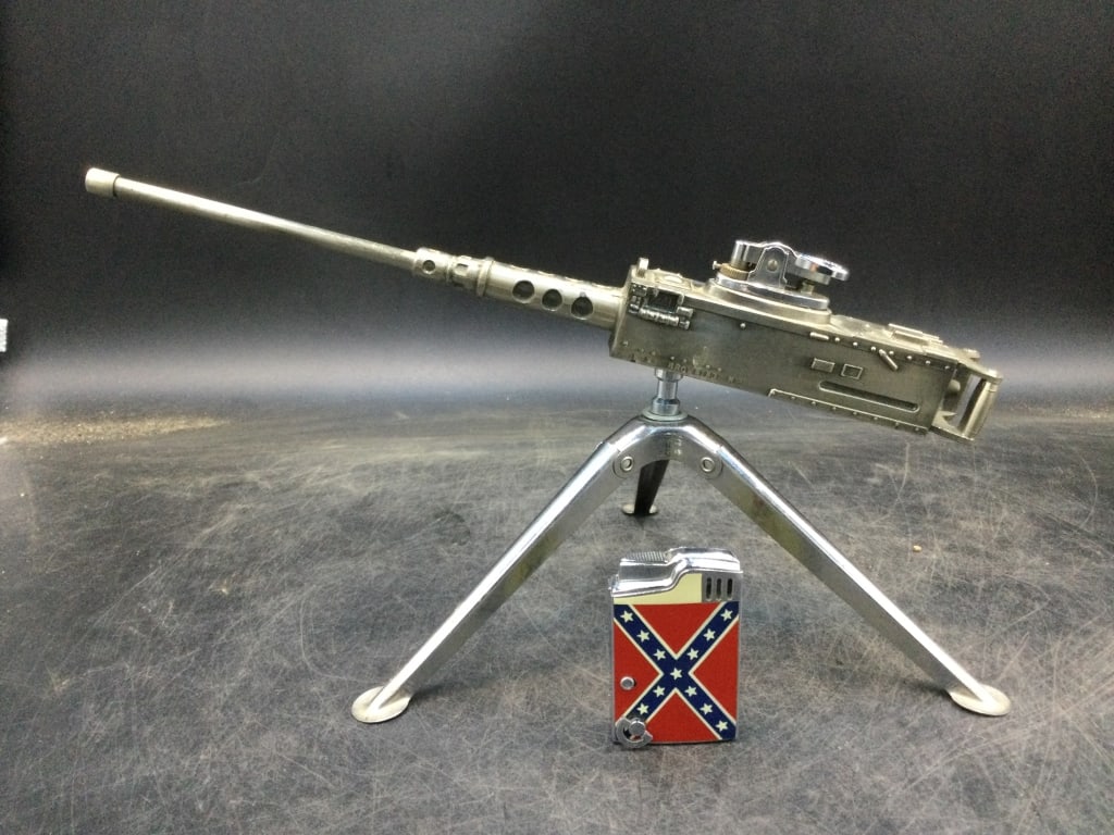 Vintage Lighters: One is vintage Browning M2 Lighter on tripod. Made in Japan and a cool piece. The other 1960's House of Beauregard Japan musical lighter Nashville TN. Lighter plays Dixie and works. Condition is consi