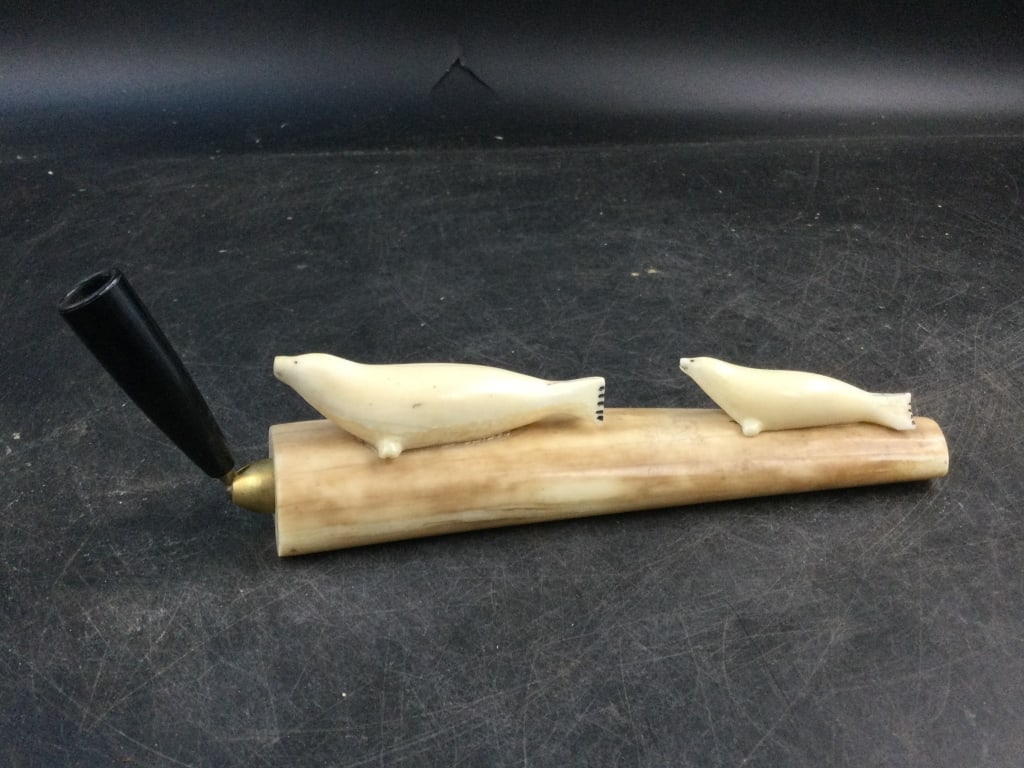 Fossilized Walrus Pen Set: Neat desk piece for your pen. Has 2 carved seals laying. Overall measures 6 3/4". Condition is good, see pictures. No refunds given.
