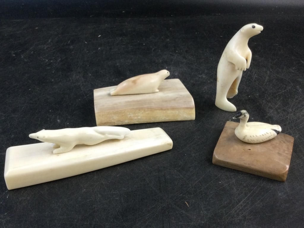Fossilized Walrus: Total of 4 carved pieces in this lot. They are 2 polar bears, seals and bird. 3 sit on walrus. Condition is good, see pictures. No refunds given.