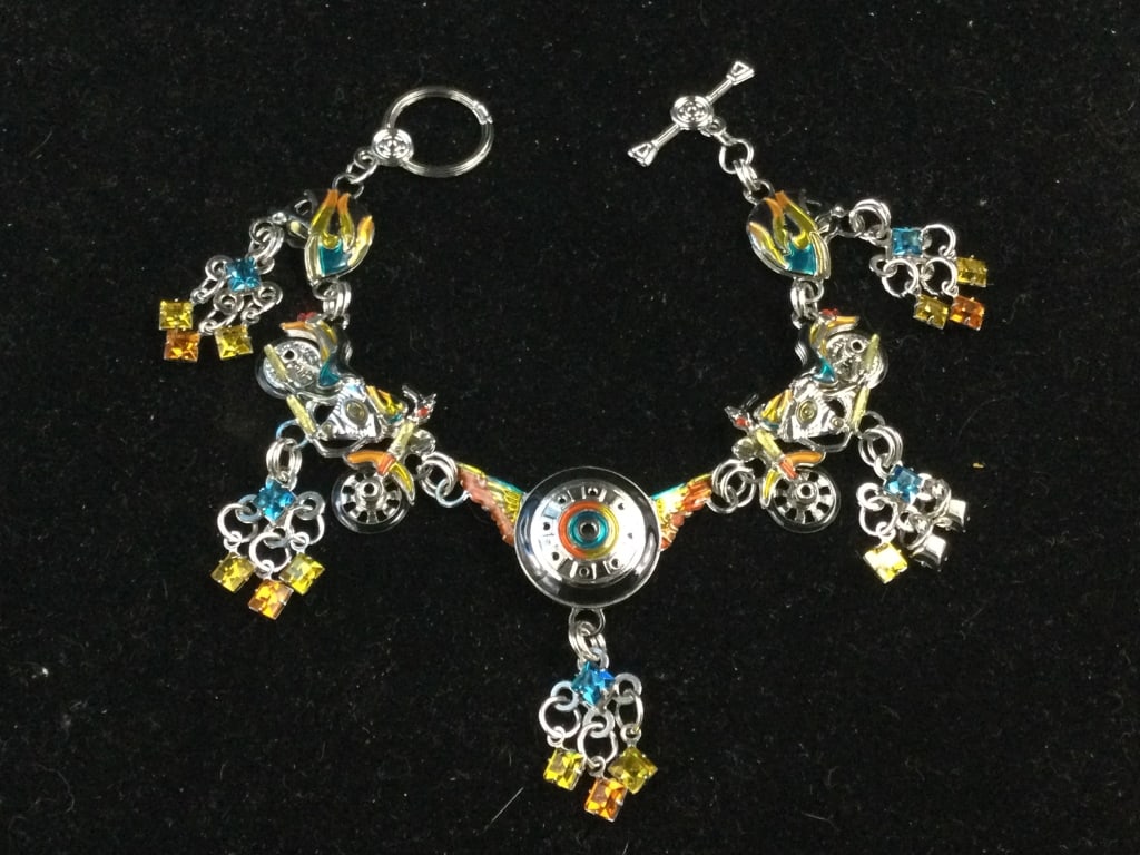Lunch at the Ritz Bracelet: Neat piece with motorcycles on bracelets. Measures 7". See pictures. No refunds given.