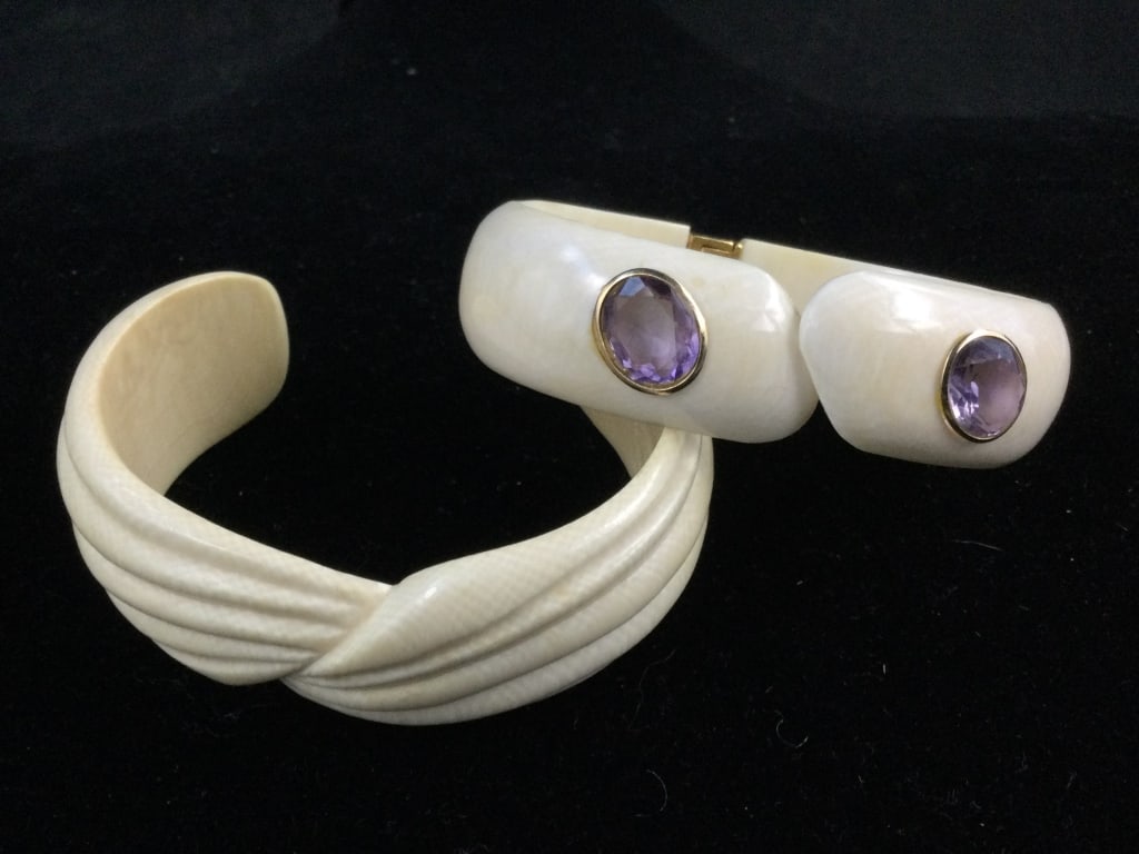 Carved Vintage Ivory Cuff Bracelets: Nice older piece with one is spring loaded. This one measures .72w and has 2 gemstones enbedded in cuff. The other one measures .99"w. Both are in good condition, see pictures. No refunds given.