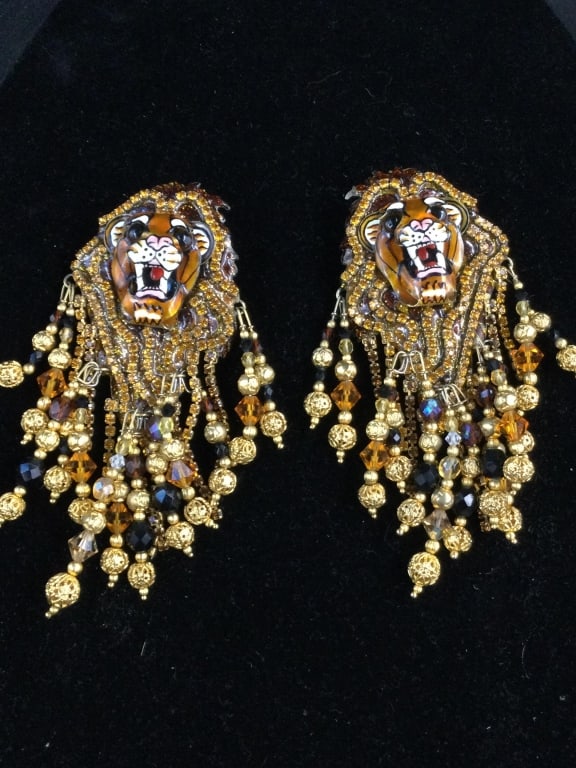 Lunch at the Ritz Lion Earrings: Neat larger clip on earrings. Measures 5 1/2"l x 1 3/4"w. Stunning pair, see pictures. Alot going on in this pair. No refunds given.