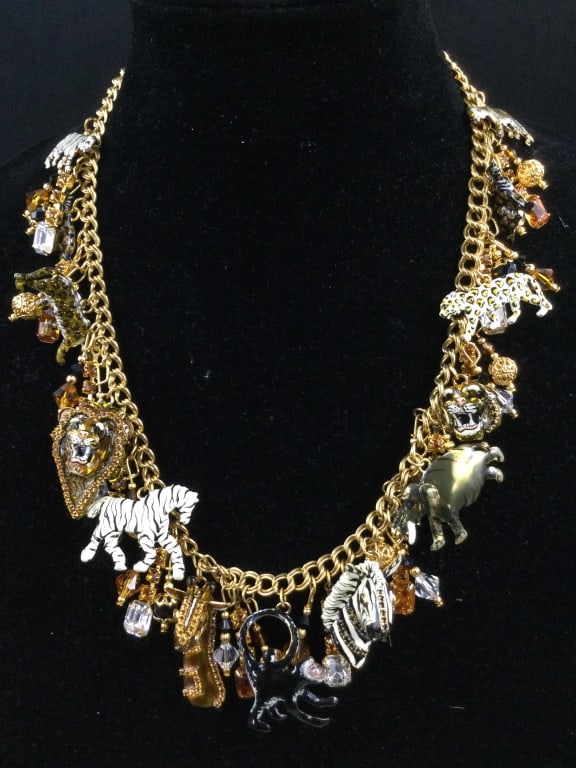 Lunch at the Ritz Safari Necklace: Nice chunky necklace filled with animals from Africa. There is lions, tigers, elephants, etc. This is very neat. Condition is good, see pictures. No refunds given.