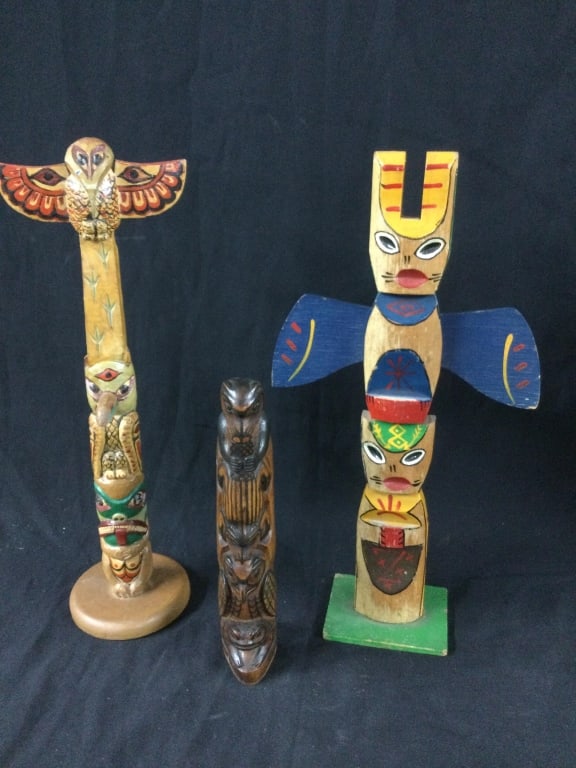 Carved Totem Poles: Hand carved totems. They measure from 9" to 14 3/4". Neat pieces, see pictures. No refunds given.
