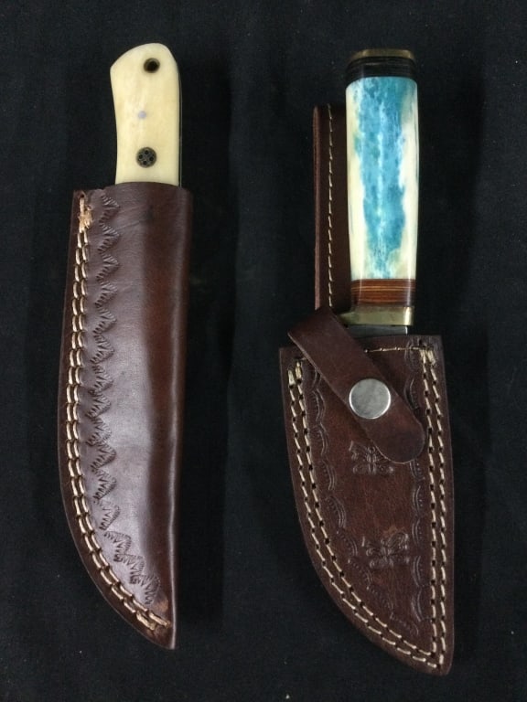 Damascus Knives: Total of 2 knives with sheaths in this lot. They both have damacus steel and condition is good. See pictures. No refunds given.