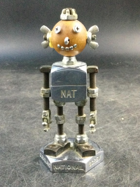 Vtg 1950's National Screw and Mfg Co: awesome piece. Cleveland Ohio advertising Robot Nat Mascot made from chrome screws and bolts. Measures 4.5"h and base is 2"w. Arms go up and down. Condition is consistent with age and use, see picture