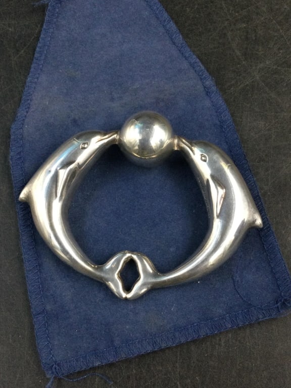 Tiffany & Co Sterling Dolphin Baby Rattle: Dolphin sterling baby rattle with bag. Condition is good, see pictures. Weighs 34.1g. No refunds given.
