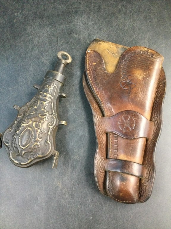 Vintage Items: One is a early holster that measures 11" x 5.5". The other piece is a ornate violin shape power flask. Measures 8" x 4". Condition is consistent on age and use, see pictures. No refunds given. Conditi