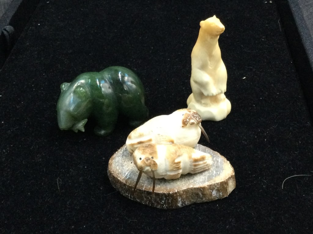Lot of Alaska Items: There is a carved polar bear with original tag on bottom 2 3/4". The next piece is carved whale base with carved walrus of 2 seals with 1 missing his tusk. The last piece is a malachite polar bear eat