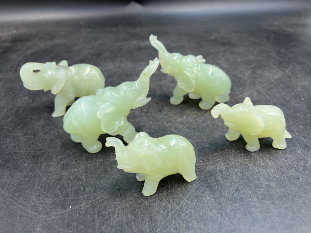Jade Elephants: Total of 5 in this lot. They range in size from 1 1/4' to 2 1/4". Condition is consistent with age and use, see pictures. no refunds given.