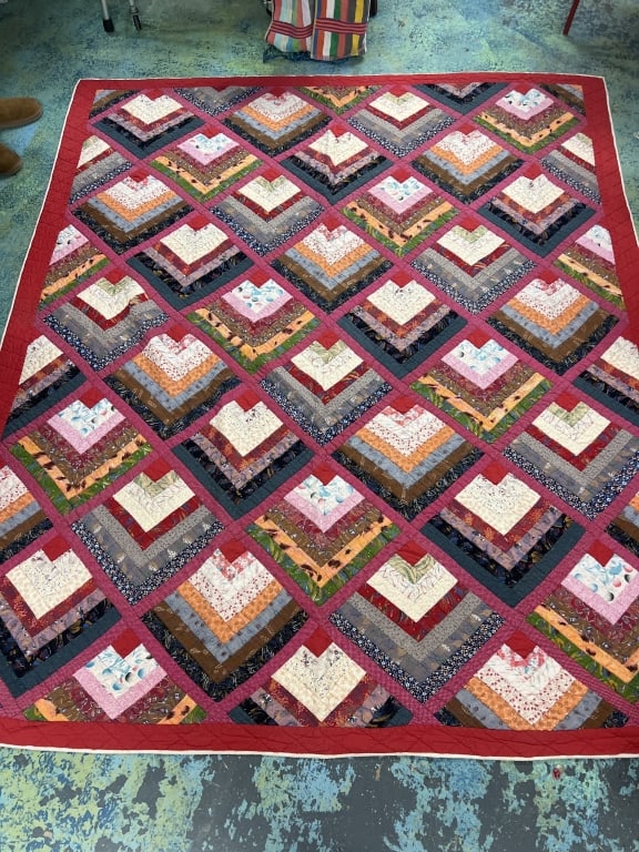 Handmade Quilt: Nice hand made quilt with vibrant colors and design. Size is 89" x 76". Condition is good, see pictures. No refunds given. The absence of a condition report does not