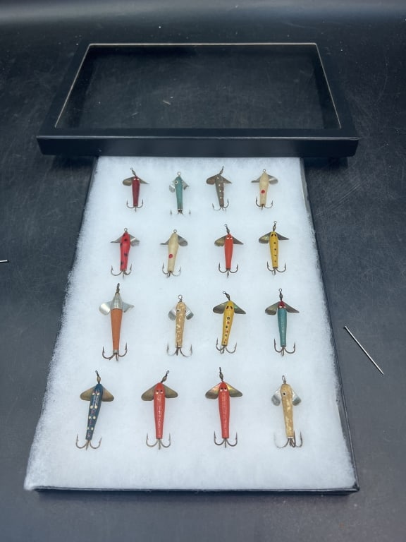Vintage McGinty Fishing Lures: Lures are characterized by their distinctive shape and painted designs. Metal body with painted finish resembling a minnow or insect. Total of 16 in a case. See pictures. No refunds given.