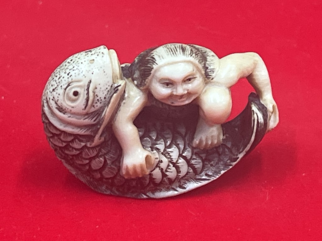 Carved Netsuke Girl Hugging Large Fish: Neat piece that is signed on her foot. appears to be scooping the fist. Condition is consistent with age see pictures. No refunds given.