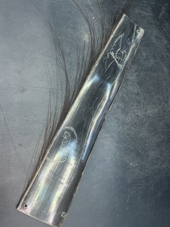 Whale Baleen Scrimshaw and Signed: Neat scene scrimshawed on this piece of Baleen. Signed S. Teguseak and measures 18 1/4" x 3.5". Condition is consistent with age, see pictures. No refunds given.