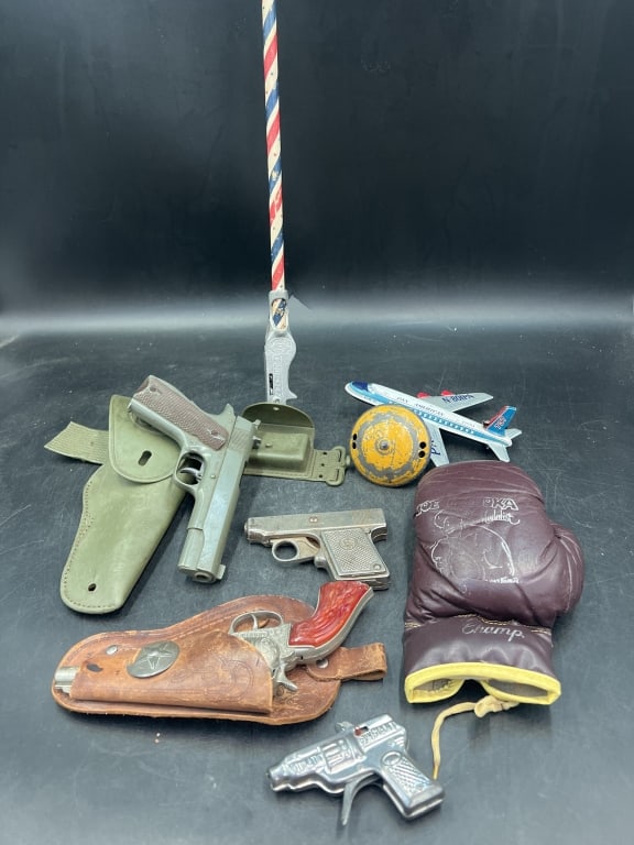 Vintage Mix Lot: This lot has a variety of items. Such boxing glove, cap guns, etcs. See pictures, condition is consistent on age and use. No refunds given.
