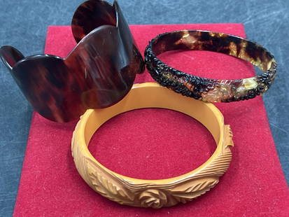 Vintage Bangles and Cuff: Total of 3 in this lot. One is butterscotch bakelite carved bangle and the other two are shell. See pictures. Condition is consistent on age and use, no refuns given.
