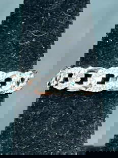 18k Diamond Eternity ring: Ring is 18k , size 6.5 and weighs 3.4g. Condition is good, see pictures. No refunds given.