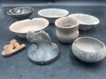 Vintage lot of Columbian Artifacts: Total of 8 American or pre Columbian pieces. There are small pots, round bowls, etc. See pictures. Condition is consistent with age. No refunds given.