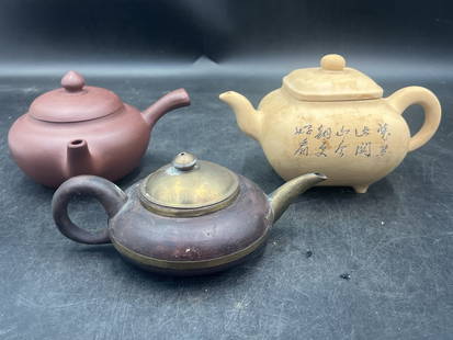Vintage Chinese Tea Pots: Total of 3 in this lot. All are signed on the bottom. Two are made from metal and the other clay ware teapot. Measures about 6"l to 7 1/4"l. They are about 2 3/4"h to 5"h. Condition is good on both, s