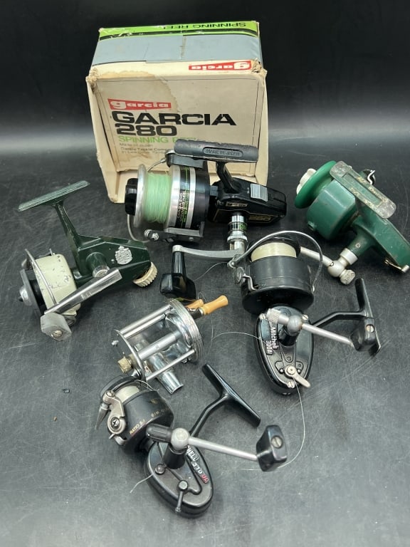 Vintage Fishing Reels: Total of 6 and 1 has original box. There is Mitchell, Garcia, Zebco, etc. Condition is consistent with age and use, see pictures. No refunds given.