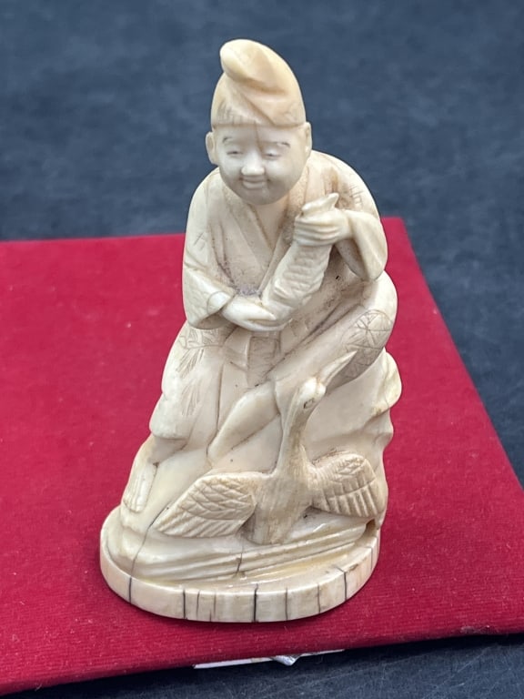 Carved Japanese Statue: Very good carving of man with bird whale tooth.out of . Meiji period and measures 4 3/4". Condition is good, see pictures. No refunds given.