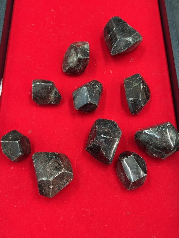 Garnets in the Rough: Total of 10 pieces in this lot. They are of a variety of sizes, see pictures. No refunds given.