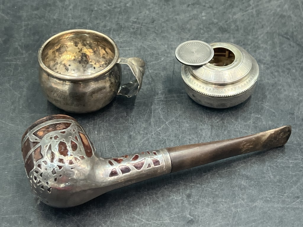 Sterling Items: There is a cup, decorative pot with lid and pipe. Pipe has silver decorating the pipe. The cup and pot weigh 824g. Condition is good, see pictures. No refunds given.