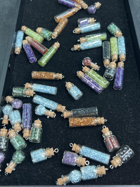 Gemstones: Huge lot of a variety of gemstones They are all in various glass mini jars.. See pictures, condition is good. No refunds given.