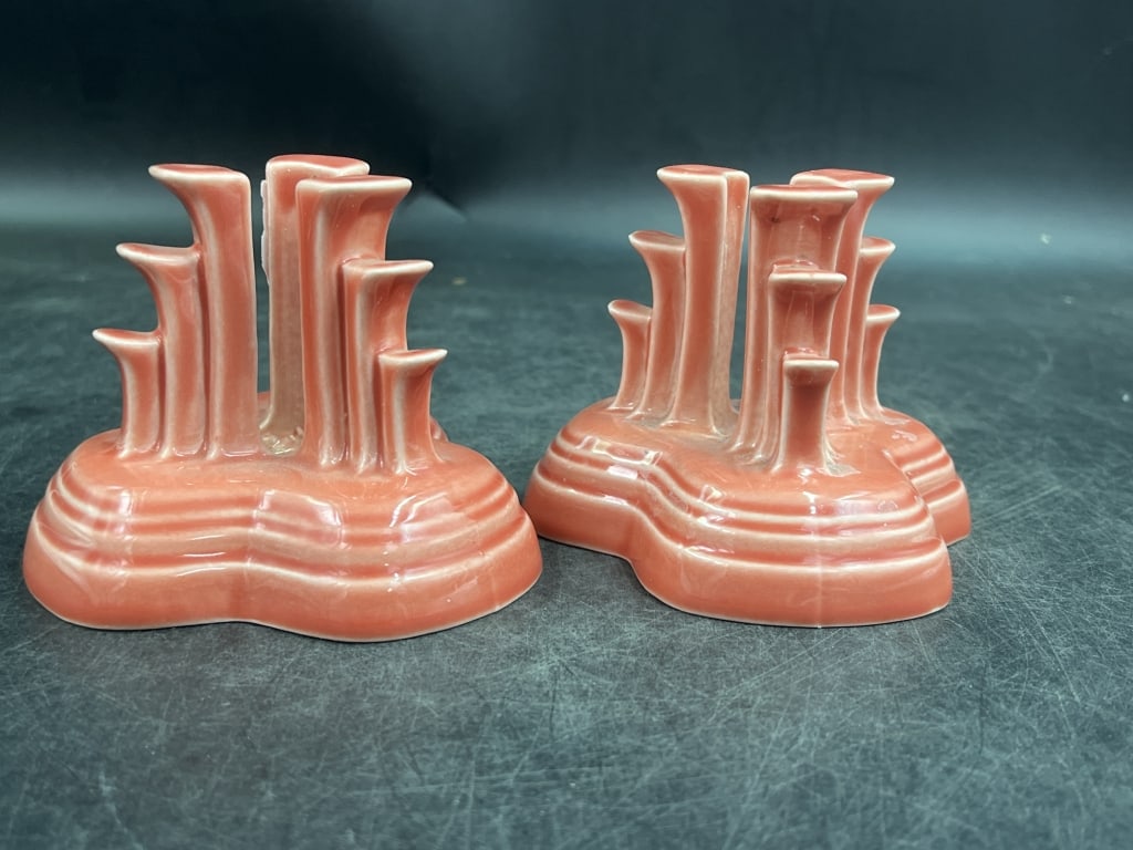 Homer Laughlin Persimmon Tripod Candleholder: Nice pair of Fiesta candleholders. Produced in 1989 and discontinued orange shade. Condition is good on both, see pictures. Measures 3.5"h x 4 1/4' x 4". No refunds given.