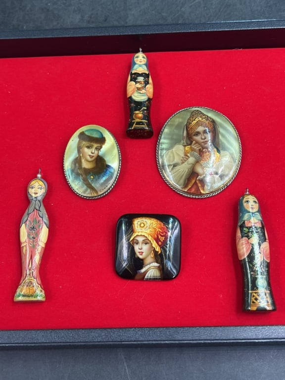 Vintage Russian Matryoshka Dolls and Brooches: There is a total of 3 dolls and 3 brooches. Condition is consistent with age and use. Nice enameled painted brooches. See pictures, no refunds given.