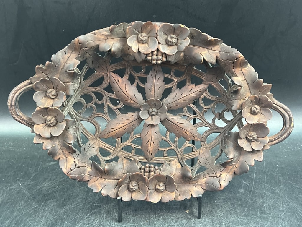 Antique Black Forest Carved Wood Tray: Possibly the 19th century. Intricate, deep carvings depicting flowers and grapes. Hand carved and has 2 handles on both sides. Condition is consistent with age and use, some wear and couple of chips.