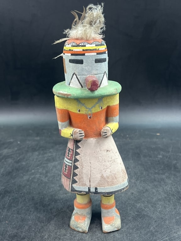 Vintage Hopi Katsina Doll: Carved typically out of cottonwood root. Out of estate of world traveler. Early 20th century carving. Solid body and defined but not separate limbs. Colored with natural mineral pigments. Condition is
