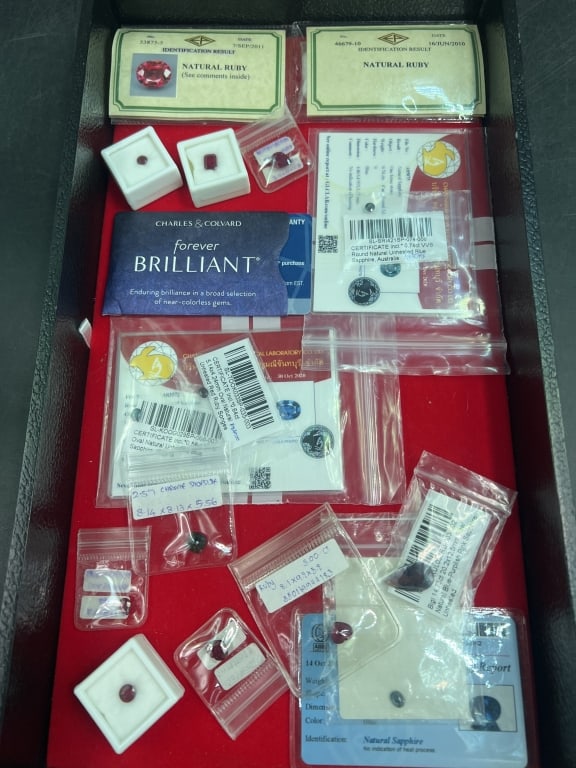 Platiinum Earrings and Gemstones: This lot has identification for the gemstones. There is Rubies, sapphire, etc. There is also a pair of platinum earrings 950 as see in pictures. See pictures. Condition is good. No refunds given.