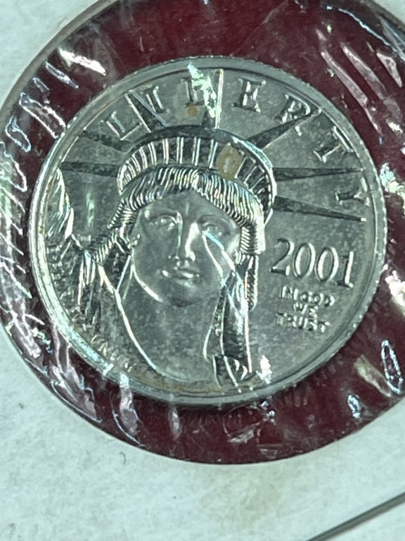 Platinum Coin $25.00: .9995 Platinum 1/4oz. Year is 2001. Coin is in good condition, see pictures. No refunds given.