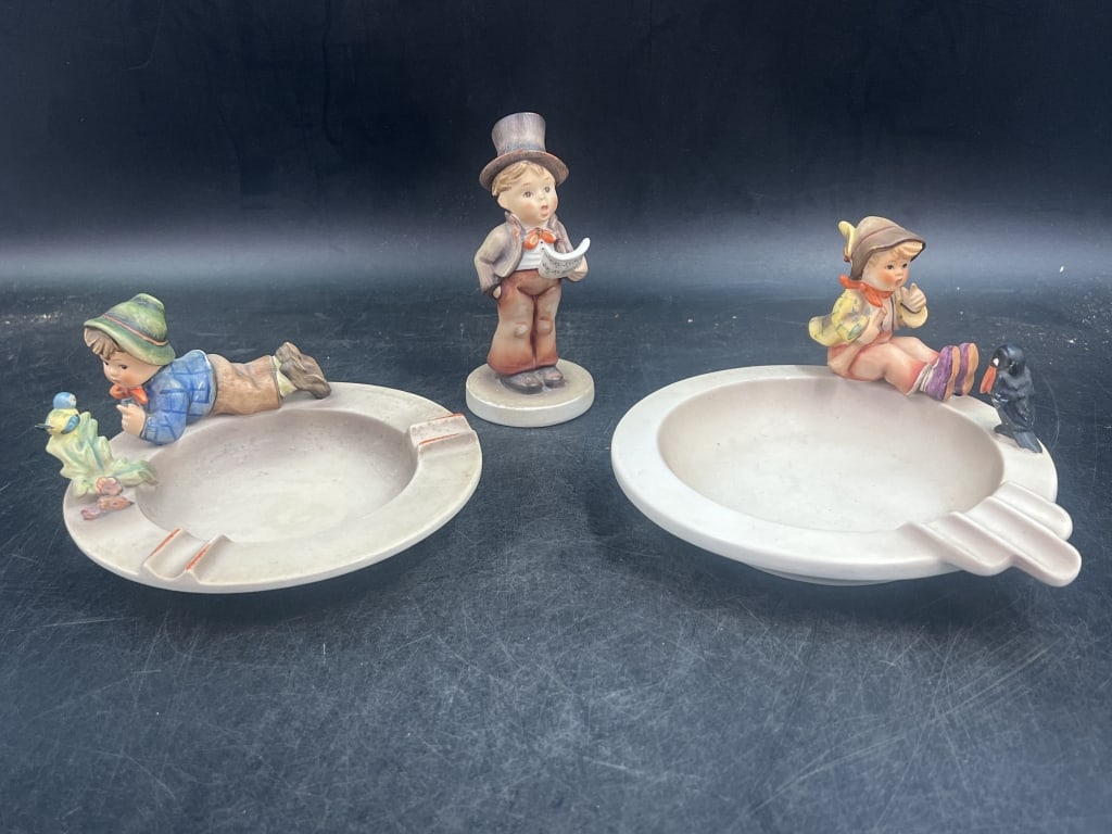 Goebel Hummel: Total of 3 pieces. There is a figurine "Street Singer" and 2 figurines on ashtrays. See pictures, made in Germany. Condition is consistent with age, see pictures. No refunds given.