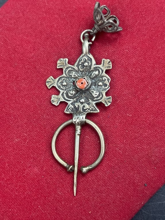 Berber Fibula or Amazigh Fibula: Made from silver and featuring a coral or orange stone detail. Vintage from the 1960's. Condition is consistent with age and use, see pictures. Weighs 15.8g and measures 4". No refunds given.