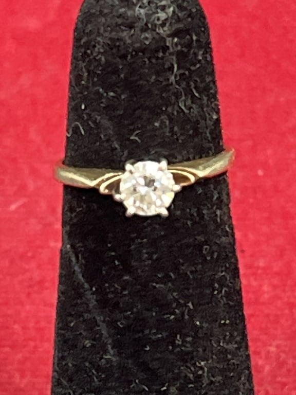 14kt Diamond Ring: Nice diamond ring. Condition is consistent with age and use, see pictures. Ring is a size 3.5 and weighs 1.5g. Diamond estimate .33 to .35. No refunds given.