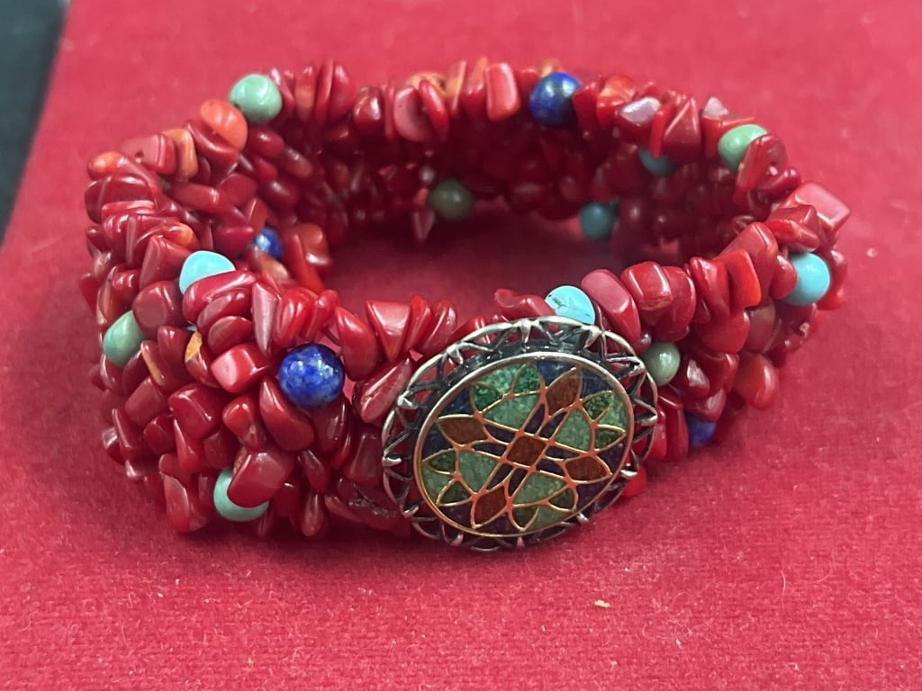 Carolyn Pollack Relios Stretch Bracelets: Sterling silver multi stone inlay red coral stretch bracelet. Vintage piece from the 1970's . Features chip style coral beads with intermittent turquoise and lapis lazuli accents. Centered by