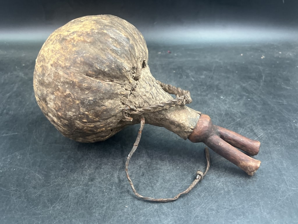 Jar African Turkian Camel Skin/Leather Far Jar: Vintage old African wood with woven twine and leather camel skin fat jar Kenya. Camel skin fat jar is called "akatom" Jug shaped vessel is fashioned with wet sand out of stomach of animals. 