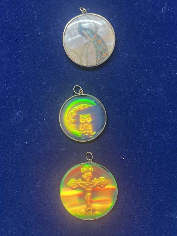 Vintage Holographic Glass Gold Pendants: Total of 3 holographic pendants. One has a parrot, cross and owl. Condition is consistent with age and use, see pictures. No refunds given.Condition Information: It is the responsibility of